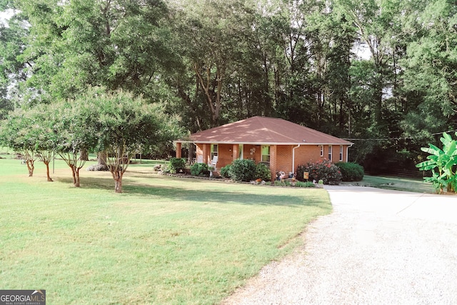 ranch-style home with a front lawn