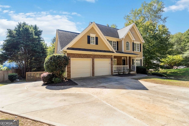 view of front facade featuring a garage and covered porch