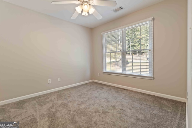 carpeted empty room with ceiling fan