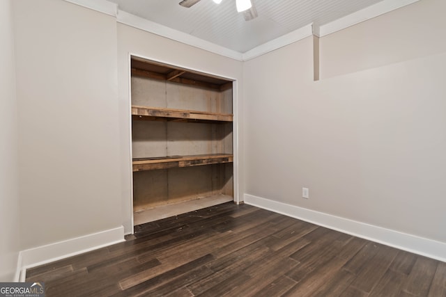 spare room with ceiling fan and dark hardwood / wood-style flooring