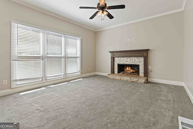 unfurnished living room with a fireplace, crown molding, and carpet flooring