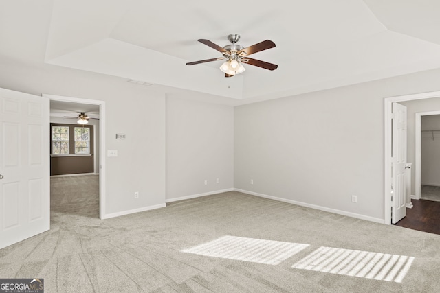 23 Brookview Dr, Newnan, GA 30265 - unfurnished bedroom with visible vents, carpet, a raised ceiling, and baseboards