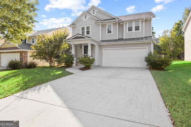 craftsman house featuring a garage and a front lawn