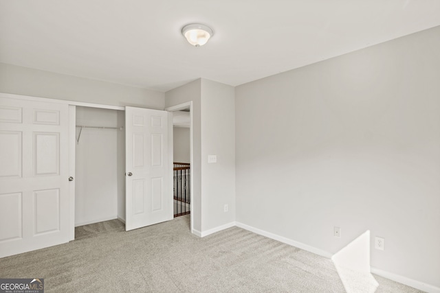 23 Brookview Dr, Newnan, GA 30265 - unfurnished bedroom featuring baseboards, carpet, and a closet