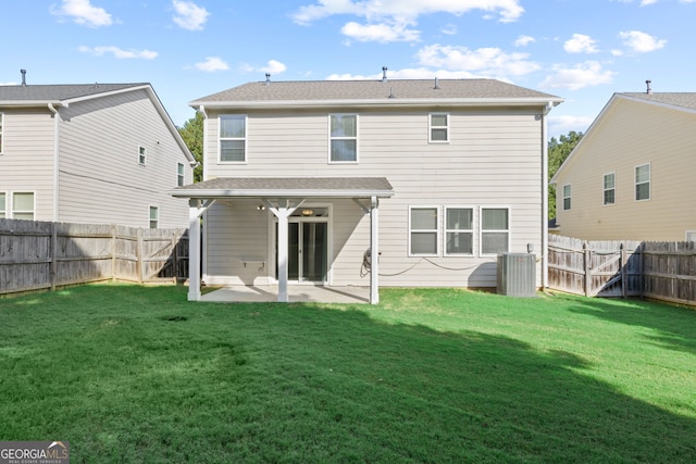 back of property featuring a lawn, a patio, and central AC unit