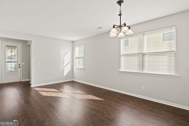 23 Brookview Dr, Newnan, GA 30265 - empty room with baseboards, wood finished floors, a chandelier, and visible vents