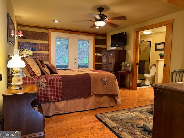 bedroom with light hardwood / wood-style floors, ceiling fan, french doors, access to outside, and ensuite bath