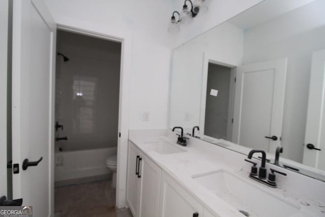 full bathroom featuring toilet, vanity, and shower / bath combination