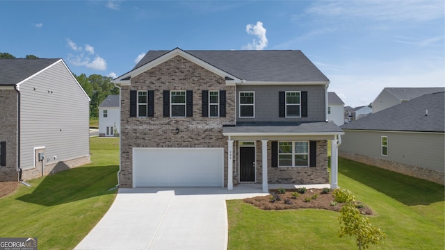 view of front of house with a garage and a front lawn