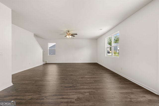 interior space with ceiling fan and dark hardwood / wood-style floors