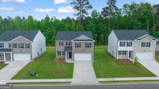 view of front facade featuring a front lawn and a garage