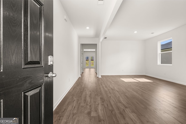 foyer entrance featuring dark wood-type flooring