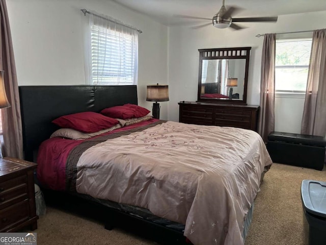 carpeted bedroom with a ceiling fan