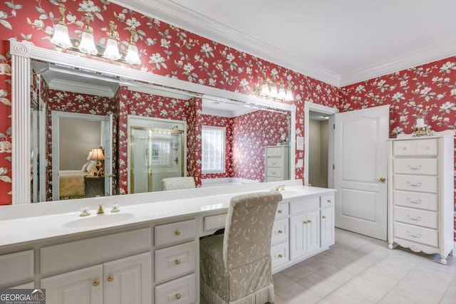 bathroom featuring tile patterned flooring, vanity, and crown molding