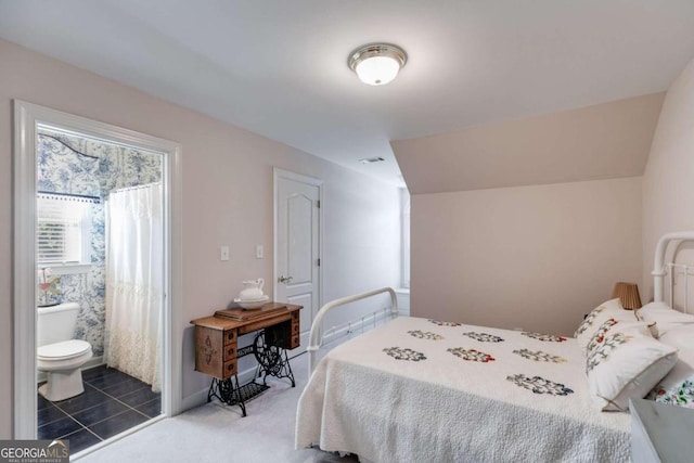 bedroom featuring vaulted ceiling and carpet floors