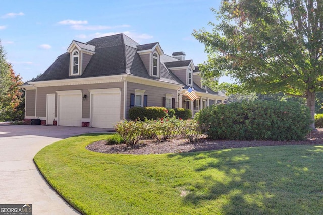 view of property exterior with a garage and a yard