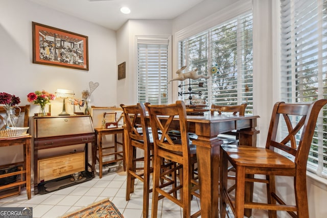 dining area featuring light tile patterned floors