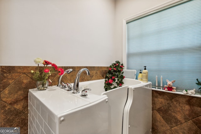 bathroom with a bathing tub