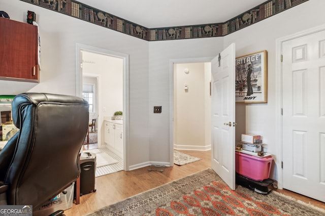 office space with light hardwood / wood-style flooring