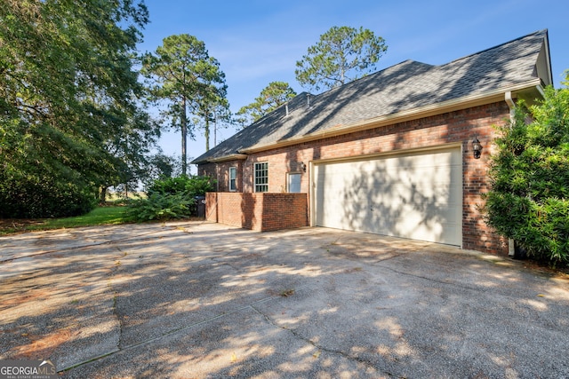 view of property exterior with a garage