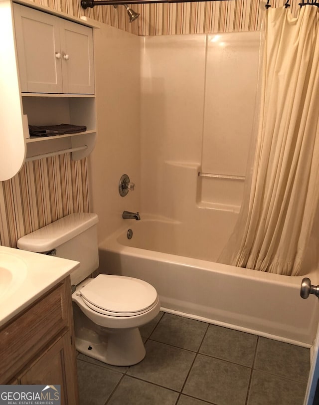 full bathroom featuring tile patterned flooring, vanity, shower / bath combination with curtain, and toilet