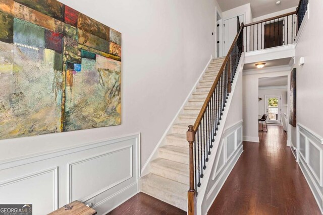 staircase featuring hardwood / wood-style floors