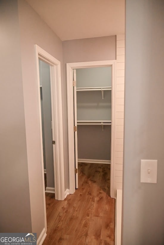 hallway featuring wood-type flooring