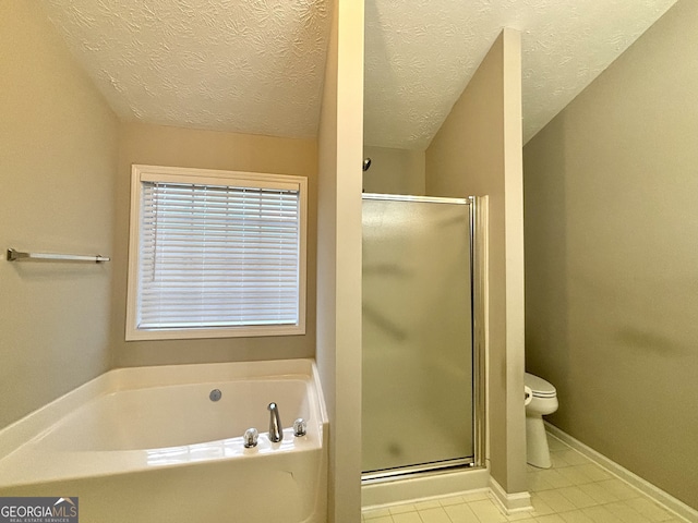 bathroom featuring a textured ceiling, separate shower and tub, tile patterned floors, and toilet