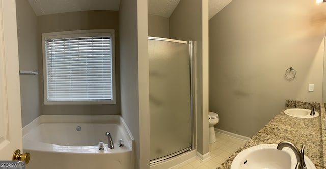 full bathroom featuring independent shower and bath, a textured ceiling, toilet, and a healthy amount of sunlight