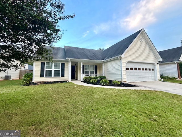 ranch-style house with a front yard, a garage, and central AC