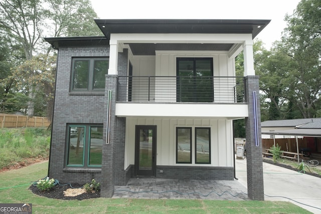 back of house with a balcony