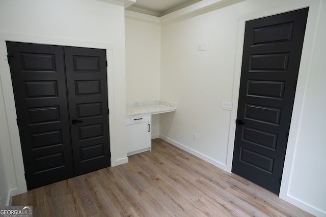 foyer with light hardwood / wood-style flooring