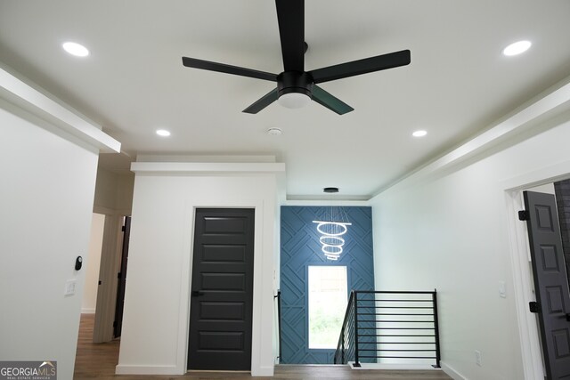 entryway featuring ceiling fan and hardwood / wood-style flooring