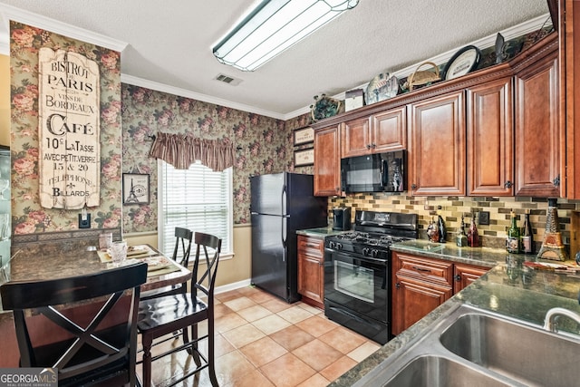 kitchen featuring light tile patterned floors, a textured ceiling, ornamental molding, and black appliances