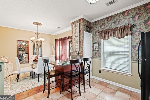 tiled dining space featuring a textured ceiling, a chandelier, and ornamental molding