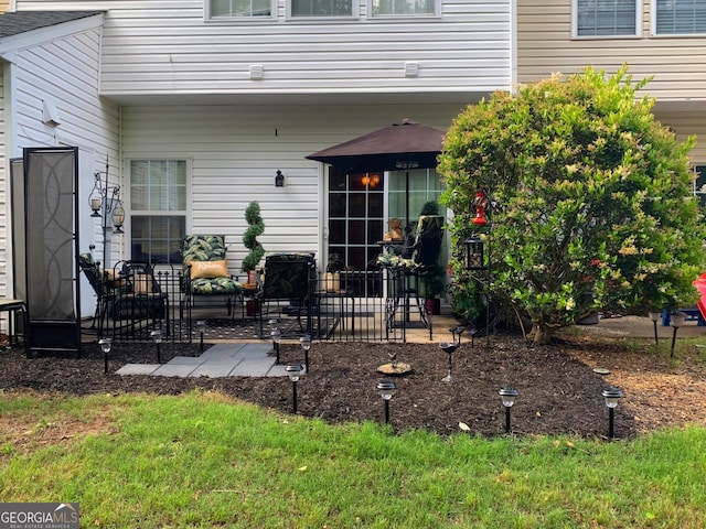 doorway to property with a patio