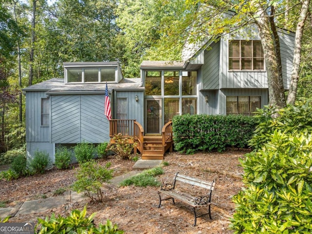 view of front of home featuring a sunroom