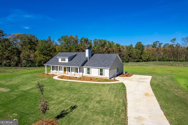 view of front of house with a front yard and a porch