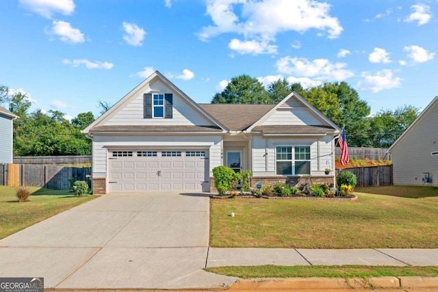 view of front of home with a garage and a front yard