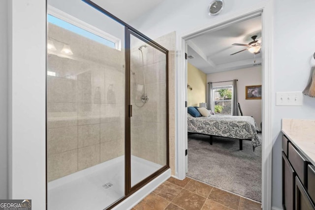 bathroom featuring vanity, a shower with shower door, and ceiling fan