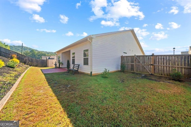 exterior space featuring a patio and a yard