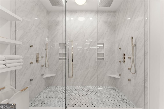 bathroom with a shower with shower door