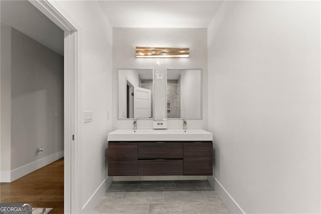 bathroom featuring vanity and hardwood / wood-style flooring