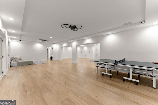 rec room with light hardwood / wood-style floors