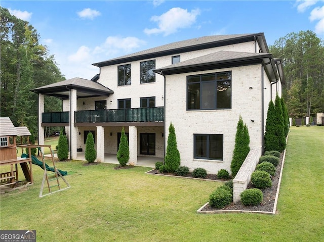 rear view of property featuring a playground and a lawn