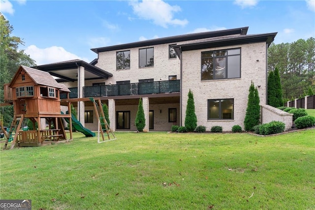 view of front of house with a front yard and a playground