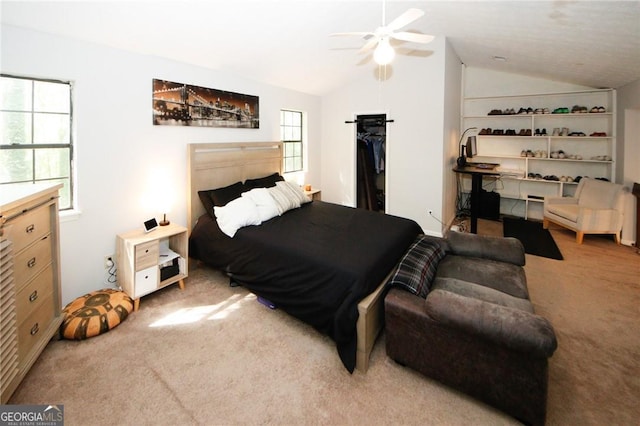 bedroom featuring lofted ceiling, carpet floors, and ceiling fan