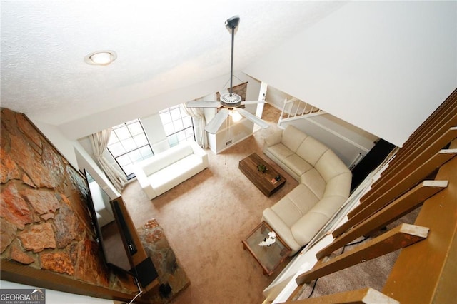 living room with vaulted ceiling and ceiling fan