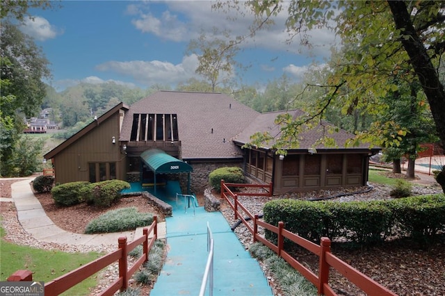 back of house featuring a pool