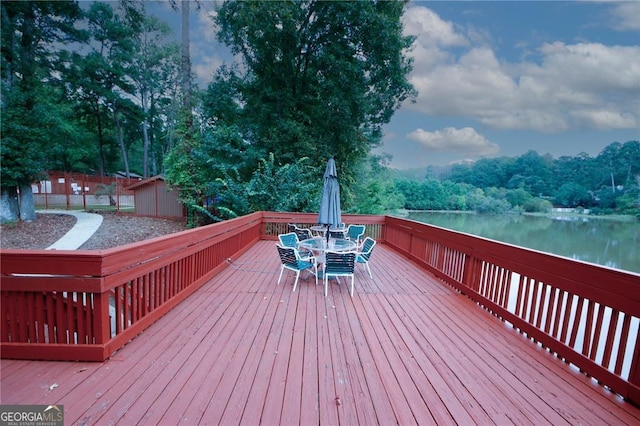 wooden deck featuring a water view